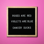Affordable Counselling Network. Sign that reads: Roses are red, Violets are blue. Cancer sucks.