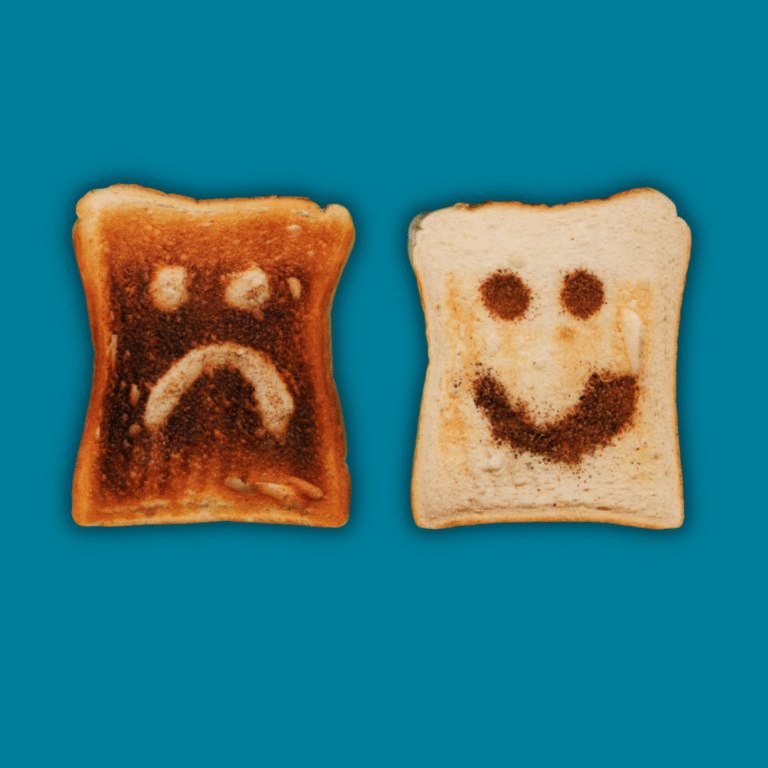Two slices of toast on a blue background, one has a happy face and the other has a sad face