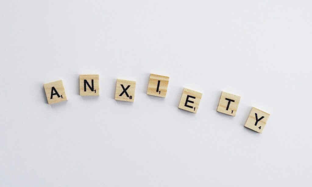 scrabble pieces spelling out the word anxiety